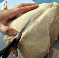 Cur the breast in half