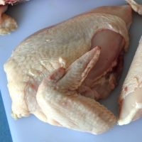 Cut backbone from breast